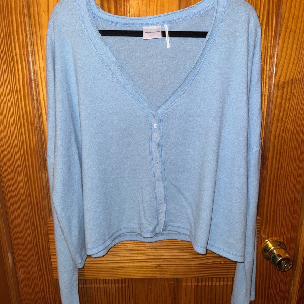 Out from under. Light Blue cardigan